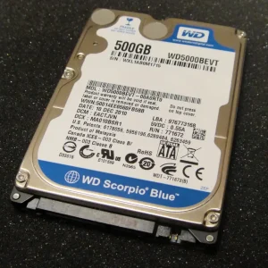 Photo of a hard disk of 500 gigabytes labelled WD Scorpio Blue. The device is a rectangular metal block that's not very thick.