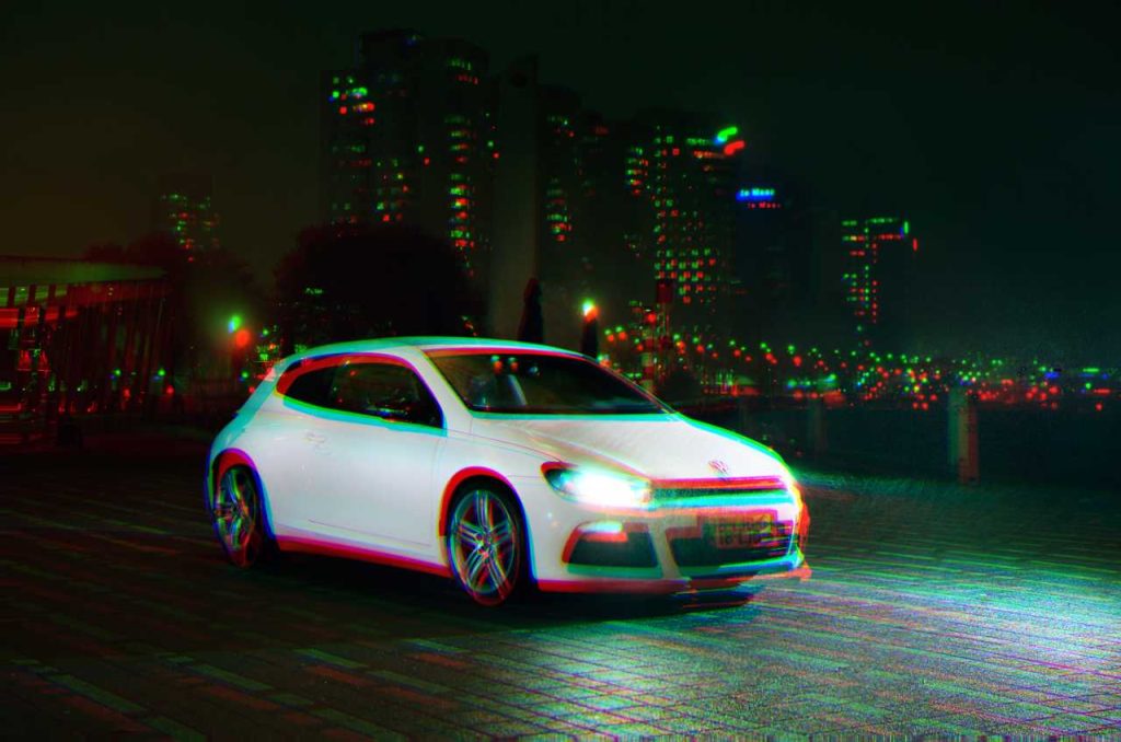 A photo of a white car with a chromatic aberration filter applied to it.