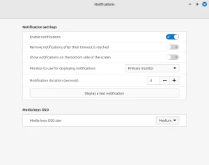 A dialog titled "Notifications." It has the following settings: heading Notification settings; switch: Enable notifications; switch: Remove notifications after their timeout is reached; switch: Show notifications on the bottom side of the screen; dropdown list button: Monitor to use for displaying notifications (value: Primary Monitor); Notification duration (seconds: 4); button: display a test notification; heading: Media keys OSD; dropdown list button: Media keys OSD size (value: Medium).